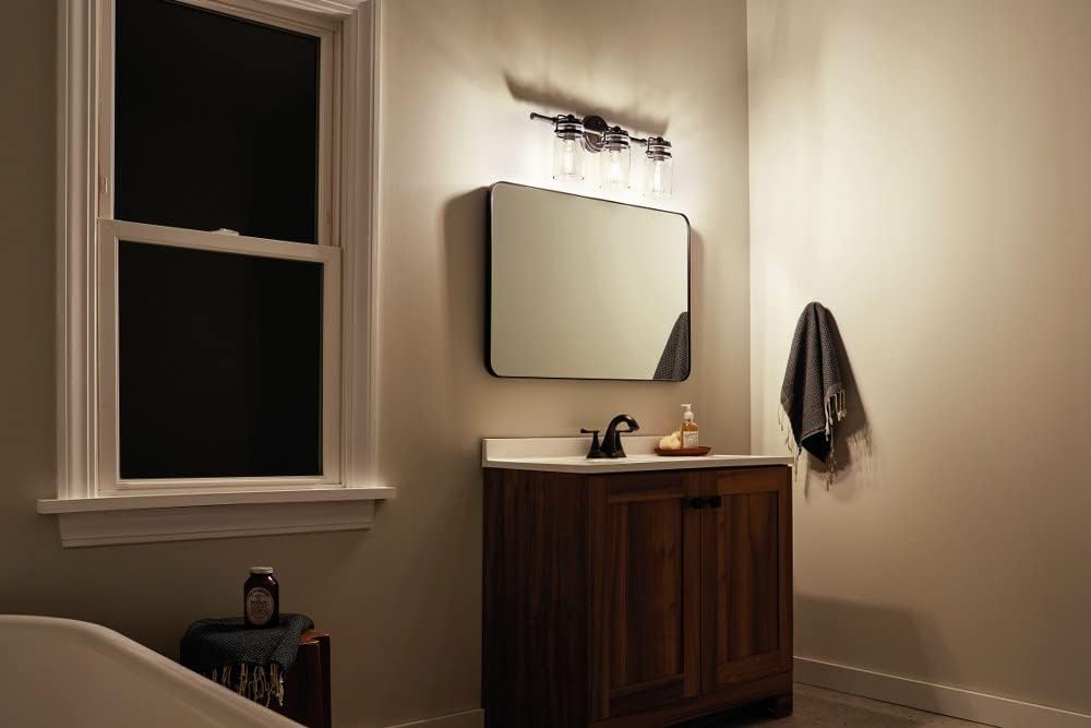 3 Light Vanity Light Approved for Damp Locations with Vintage Industrial Inspirations 10 inches Tall by 24 inches Wide-Champagne Bronze Finish 147-Bel-4763250