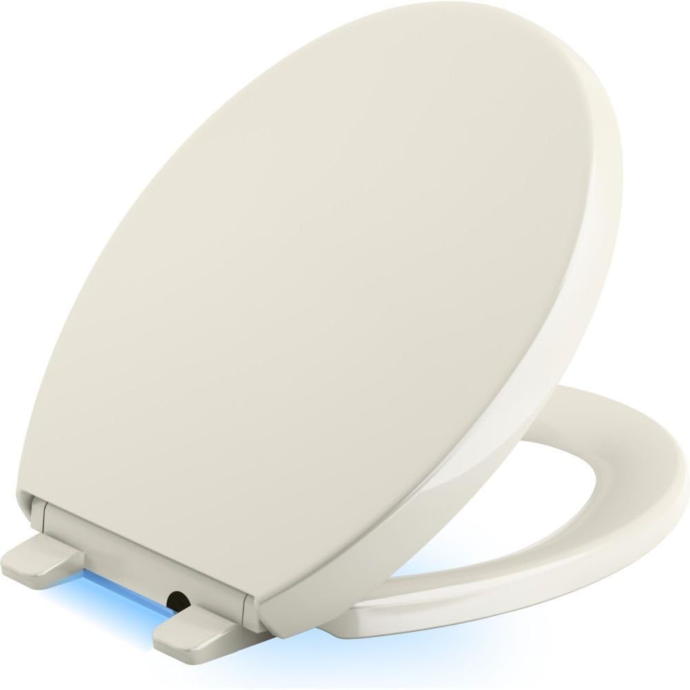 KOHLER 75793-96 Reveal Nightlight Quiet-Close with Grip-Tight Round-Front Toilet Seat, Biscuit