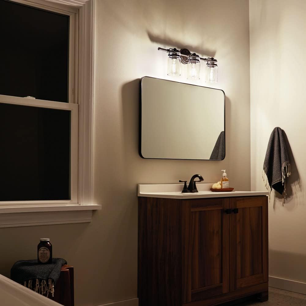 3 Light Vanity Light Approved for Damp Locations with Vintage Industrial Inspirations 10 inches Tall by 24 inches Wide-Champagne Bronze Finish 147-Bel-4763250