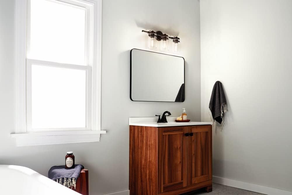 3 Light Vanity Light Approved for Damp Locations with Vintage Industrial Inspirations 10 inches Tall by 24 inches Wide-Champagne Bronze Finish 147-Bel-4763250
