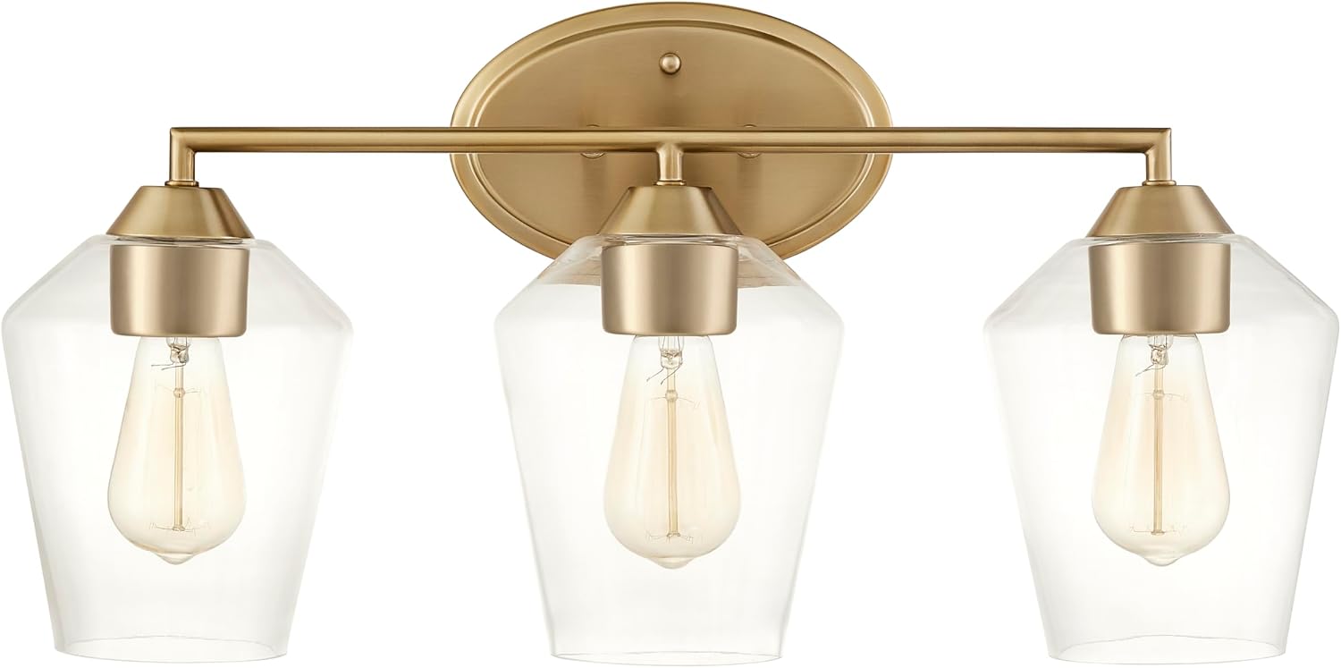 Aspen Creative 62738-27-3, Three-Light Metal Bathroom Vanity Wall Light Fixture, 22-1/4' Wide, Transitional Design in Light Bronze with Clear Glass Shade.