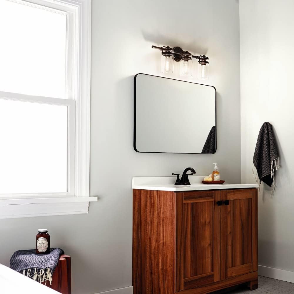 3 Light Vanity Light Approved for Damp Locations with Vintage Industrial Inspirations 10 inches Tall by 24 inches Wide-Champagne Bronze Finish 147-Bel-4763250