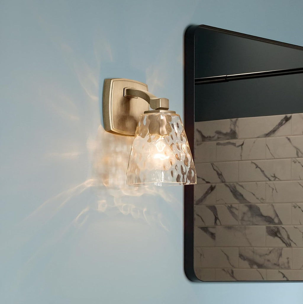 Kichler Marant 5' 1-Light Wall Sconce Bathroom Vanity Light Fixture with Clear Water Glass in Champagne Bronze for Bathroom, Powder Room and Hallway (5' W x 9.5' H), 55214CPZWTR
