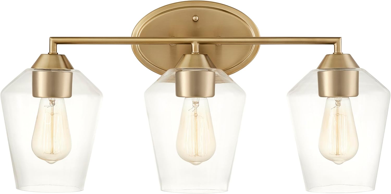 Aspen Creative 62738-27-3, Three-Light Metal Bathroom Vanity Wall Light Fixture, 22-1/4' Wide, Transitional Design in Light Bronze with Clear Glass Shade.