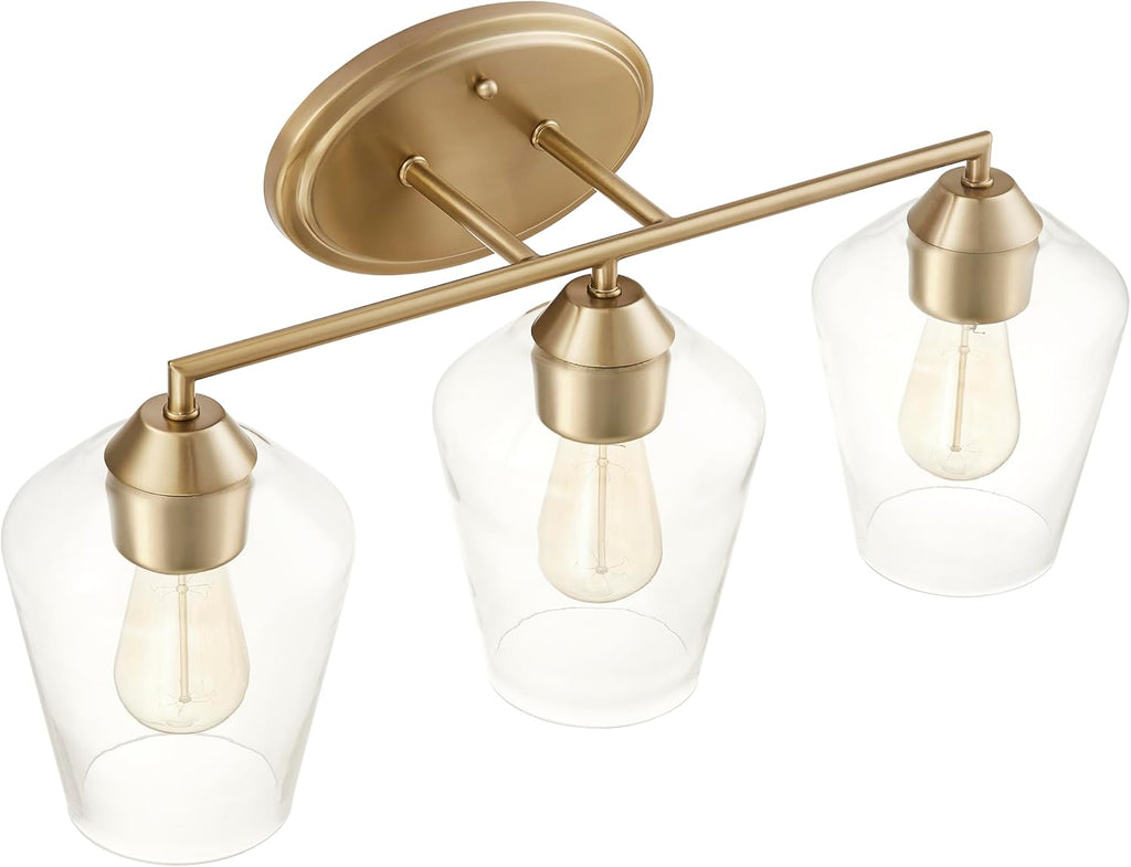 Aspen Creative 62738-27-3, Three-Light Metal Bathroom Vanity Wall Light Fixture, 22-1/4' Wide, Transitional Design in Light Bronze with Clear Glass Shade.