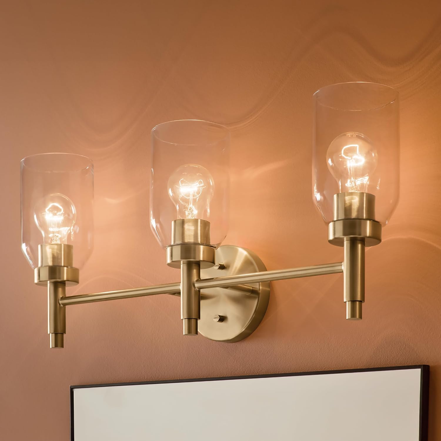 Kichler Madden 3-Light Bathroom Vanity Light Fixture with Clear Glass in Champagne Bronze, Modern Wall Mount Lighting for Single Vanity Mirror (10.5' x 24'), 55185CPZ