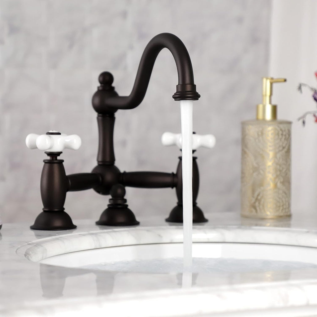 Kingston Brass KS3915PX Restoration Widespread Lavatory Faucet with Porcelain Cross Handle, Oil Rubbed Bronze